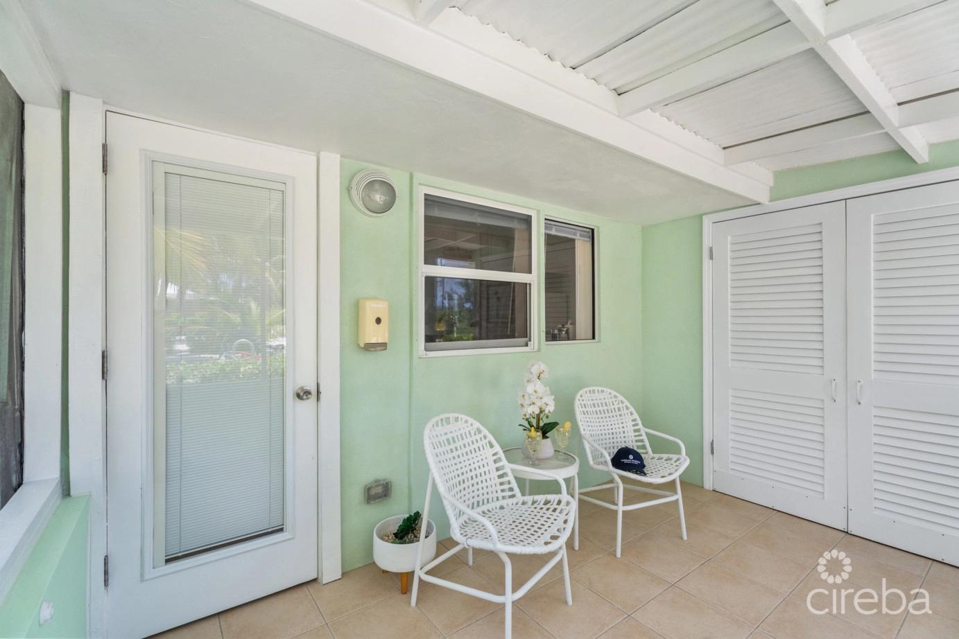Cayman Kai Sea Lodge #13 Beachfront Condo With Impressive Rental History — photo 4