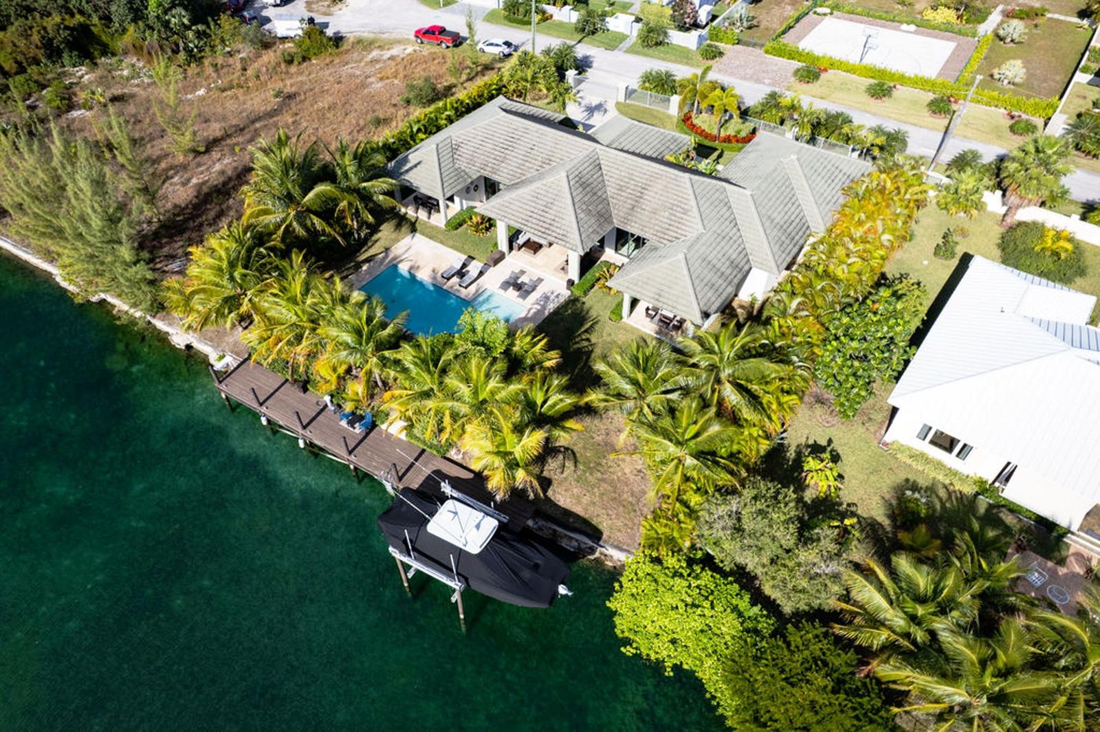 Exclusive Waterfront Living, Pool, Style & Turn-Key Luxury — photo 1