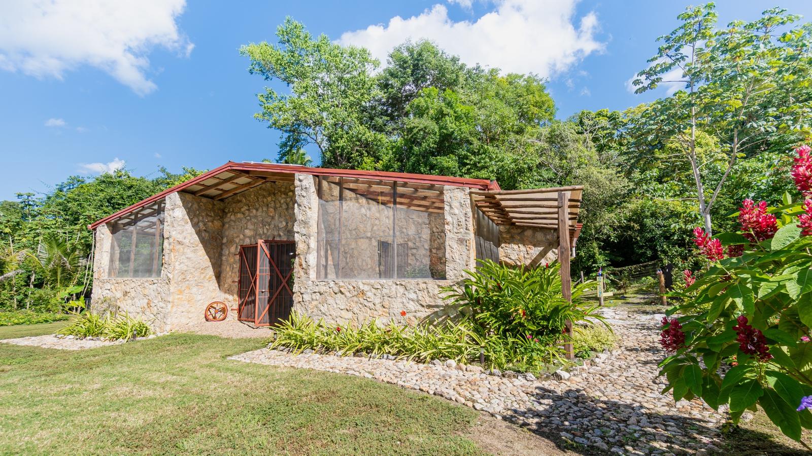 Spectacular Off-Grid Mayan Retreat with Two Stone Buildings, 2 Acres of Land, and Pond near San Ignacio Town — photo 1