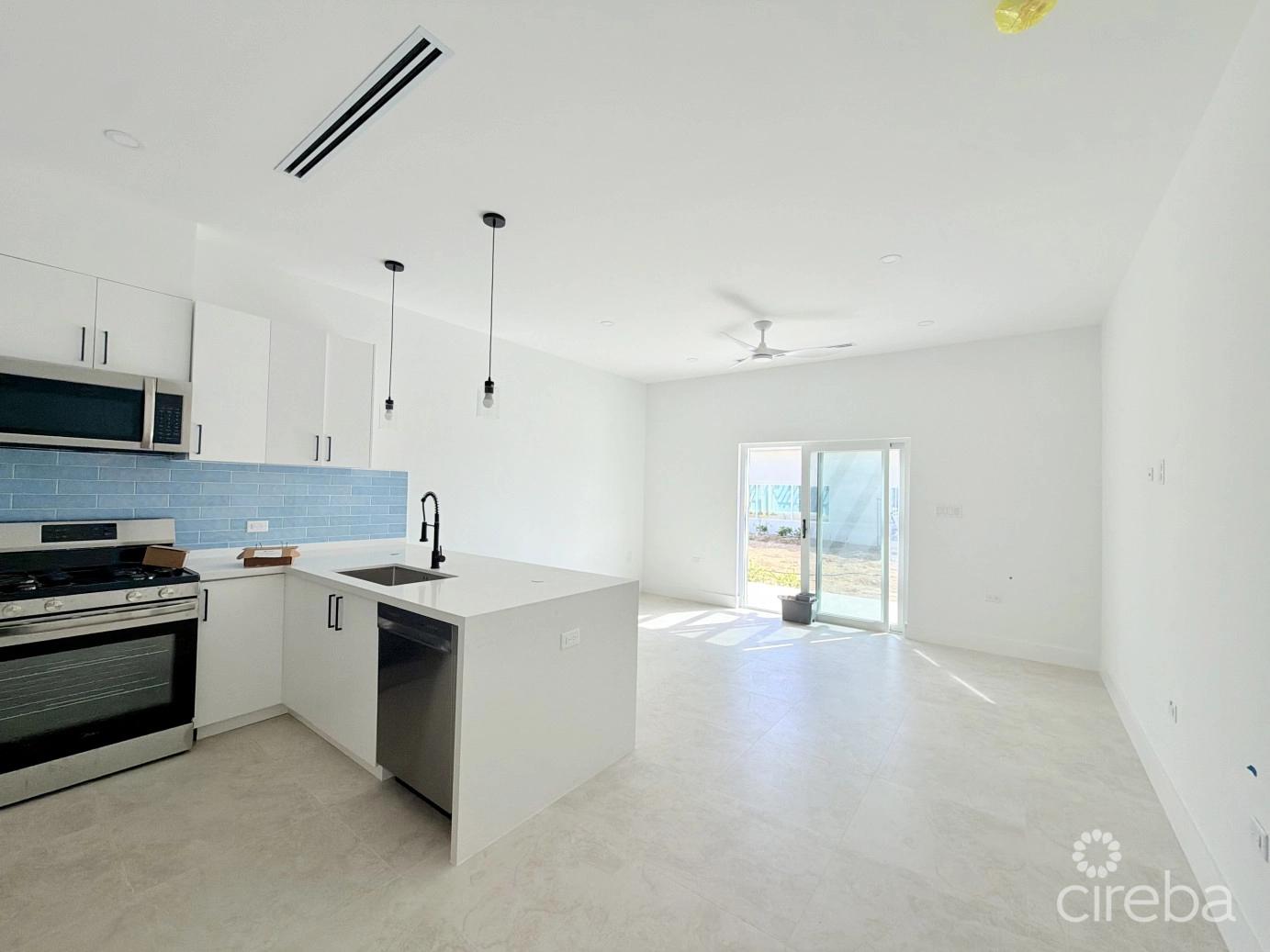 1 bedroom property for sale — Large One Bedroom Townhome - The Meadows At Batabano — photo 1