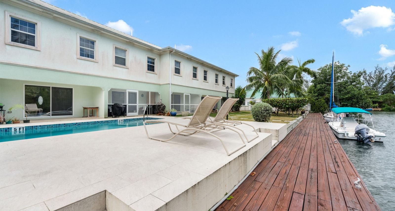 Canal Front Large 2 Bed 2.5 Bath Townhome In Omega Bay With Dock Space — photo 1