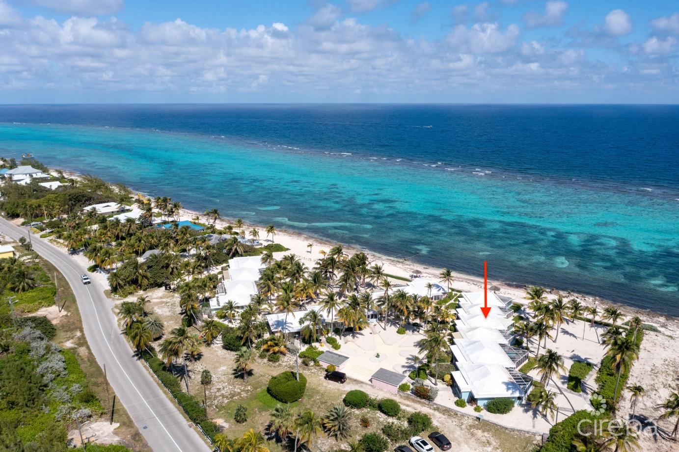 Cayman Kai Sea Lodge #13 Beachfront Condo With Impressive Rental History — photo 1